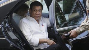 Philippine President Rodrigo Duterte steps out of his limousine upon arrival at Merdeka Palace to meet Indonesian counterpart Joko Widodo in Jakarta, Indonesia, Friday, Sept. 9, 2016.