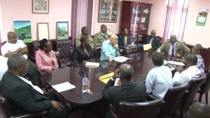 PM Harris at the head of table (right) chaired the meeting between Government and private partners