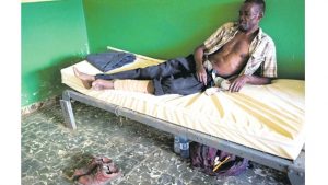 An injured man lies on a bed at the state hospital in Dame-Marie, Hait, on Monday. Nearly a week after Hurricane Matthew smashed into southwestern Haiti, some communities along the southern coast have yet to receive any assistance, leaving residents who have lost their homes and virtually all of their belongings struggling to find shelter and potable water.