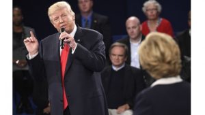 US Democratic Presidential nominee Hillary Clinton (R) and Republican Presidential nominee Donald Trump participate in a town hall debate at Washington University in St Louis, Missouri, on October 9, 2016. 