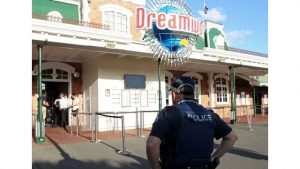 A police officer stands in front of the Dreamworld theme park on Gold Coast on October 25, 2016, after four people were killed when a park ride malfunctioned.
