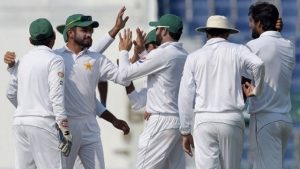 Pakistani cricketers celebrate after the dismissal of West Indies' batsman Darren Bravo (unseen) on the fourth day of the second Test between Pakistan and the West Indies at the Sheikh Zayed Cricket Stadium in Abu Dhabi on October 24, 2016