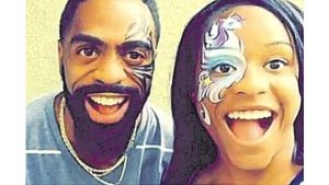Tyson Gay and daughter Trinity enjoy a clown moment.