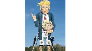 Artists Frank Shepherd and Andrea Deans put the finishing touches to the Edenbridge Bonfire Society celebrity effigy depicting US Presidential hopeful Donald Trump carrying the head of rival Hilary Clinton, after being unveiled in Edenbridge, England, yesterday. The Edenbridge effigy always portrays a figure from the news, before being set afire on Britain’s traditional bonfire night on November 5.