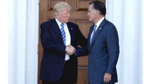 U.S. President-elect Donald Trump shakes hands with former Massachusetts Governor Mitt Romney after their meeting at the main clubhouse at Trump National Golf Club in Bedminster, New Jersey, on Nov. 19, 2016. 