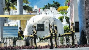 A guard of honour stays by the tomb of Cuban leader Fidel Castro at the Santa Ifigenia cemetery in Santiago de Cuba yesterday.